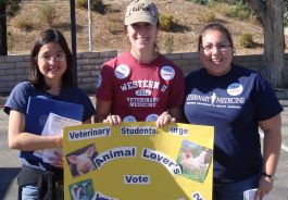 Western veterinary students holding Prop 2 poster